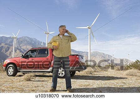Senior man working at wind farm View Large Photo Image Stock Image - Senior man working at wind farm. Fotosearch