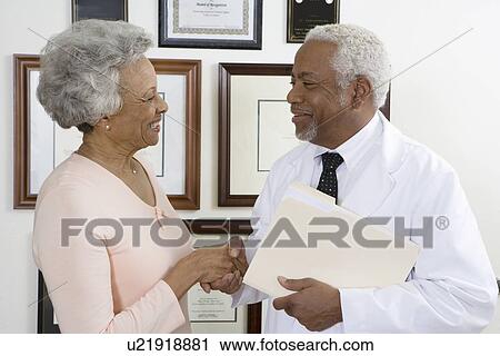 Senior medical practitioner and client View Large Photo Image Stock Image - Senior medical practitioner and client. Fotosearch