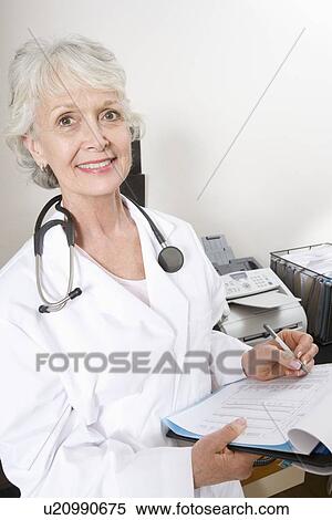 Senior medical practitioner and clipboard View Large Photo Image Stock Photography - Senior medical practitioner and clipboard. Fotosearch