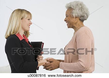 Stock Photograph - Senior Woman Meeting Financial Advisor. Fotosearch