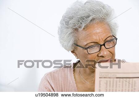 Senior Woman Studying Stocks and Shares View Large Photo Image Stock Photo - Senior Woman Studying Stocks and Shares. Fotosearch