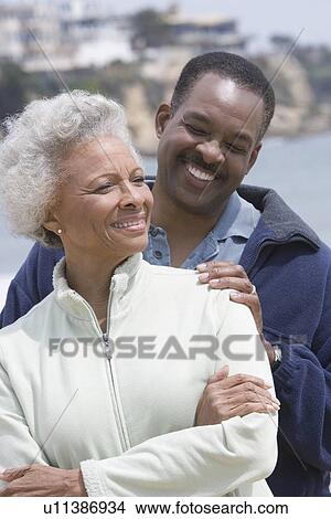 Senior woman with mature man on beach View Large Photo Image Picture - Senior woman with mature man on beach. Fotosearch