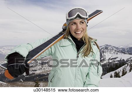 Skier Carrying Skis on Mountain View Large Photo Image Stock Photography - Skier Carrying Skis on Mountain. Fotosearch