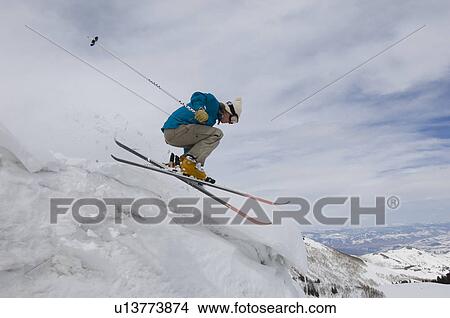 Skier Jumping Off Icy Overhang View Large Photo Image Picture - Skier Jumping Off Icy Overhang. Fotosearch