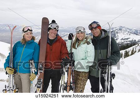 Skiers Holding Skis on Mountain View Large Photo Image Stock Image - Skiers Holding Skis on Mountain. Fotosearch