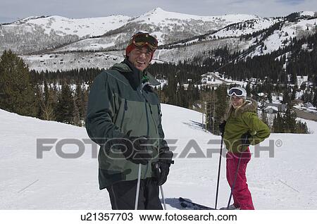 Stock Image - Skiers on Slopes at Ski Resort. Fotosearch