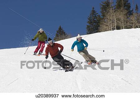 Stock Photo - Skiers Skiing Down Slope. Fotosearch