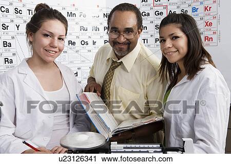 Stock Image - Students and Teacher in Science Class. Fotosearch