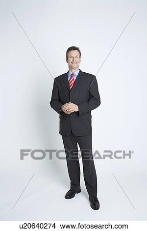 Picture - Studio portrait of businessman. Fotosearch