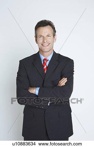 Studio portrait of businessman smiling View Large Photo Image Picture - Studio portrait of businessman smiling. Fotosearch