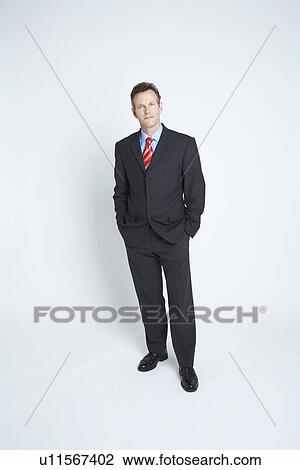 Stock Image - Studio portrait of businessman. Fotosearch