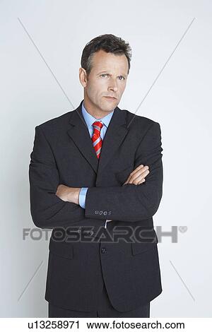 Stock Image - Studio portrait of businessman. Fotosearch