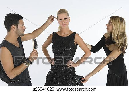 Stylists attend to model View Large Photo Image Stock Image - Stylists attend to model. Fotosearch