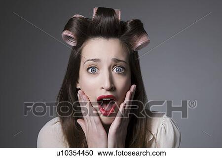 Surprised young woman with hair curlers and red lipstick View Large Photo Image Stock Image - Surprised young woman with hair curlers and red lipstick. Fotosearch