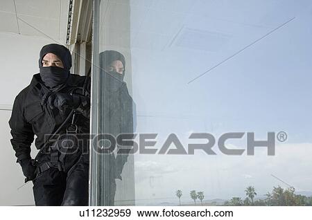 Stock Photo - SWAT Team Officer in Window. Fotosearch