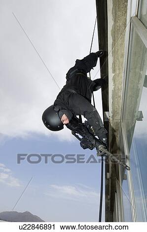 SWAT Team Officer Rappelling from Building View Large Photo Image Stock Image - SWAT Team Officer Rappelling from Building. Fotosearch
