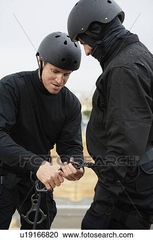 SWAT Team Preparing Climbing Equipment View Large Photo Image Stock Image - SWAT Team Preparing Climbing Equipment. Fotosearch