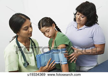 Stock Photo - Taking blood pressure. Fotosearch
