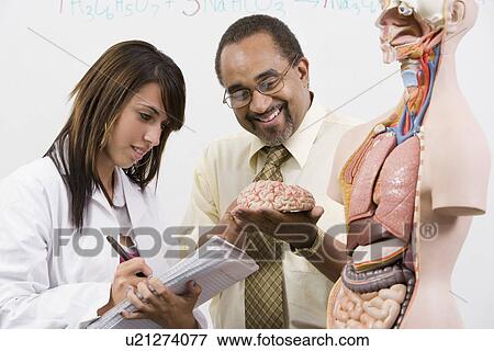Stock Photo - Teacher and Student in Science Lab. Fotosearch