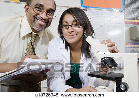 Stock Photography - Teacher and Student in Science Lab. Fotosearch