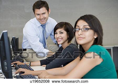Stock Photo - Teacher and Students in Computer Lab. Fotosearch