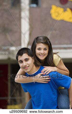 Teenage Boy Giving Girlfriend Piggy Back Ride View Large Photo Image Stock Image - Teenage Boy Giving Girlfriend Piggy Back Ride. Fotosearch