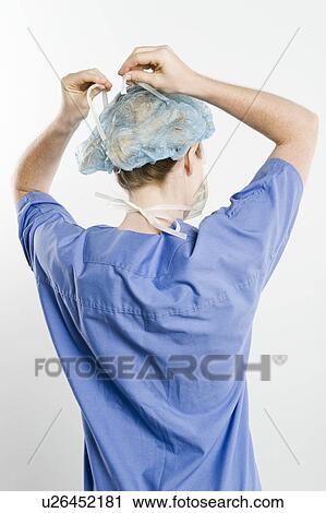Threatre nurse, rear view View Large Photo Image Stock Image - Threatre nurse, rear view. Fotosearch