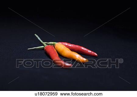 Three chilli peppers View Large Photo Image Stock Photo - Three chilli peppers. Fotosearch