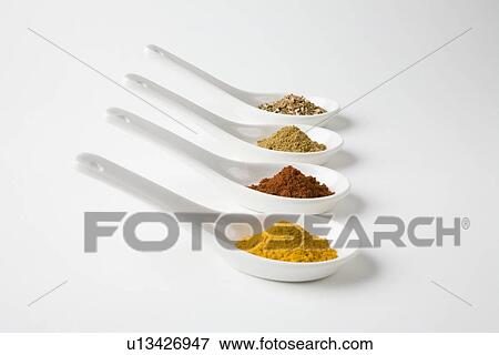 Stock Photo - Turmeric, chilli, cumin and chinese 5 spice. Fotosearch