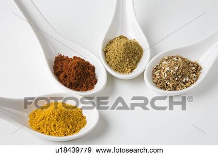Stock Photo - Turmeric, chilli, cumin and chinese 5 spice. Fotosearch