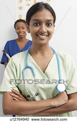 Two doctors in hospital, portrait View Large Photo Image Stock Image - Two doctors in hospital, portrait. Fotosearch