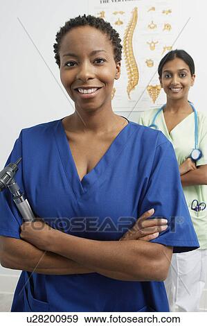 Two doctors in hospital, portrait View Large Photo Image Stock Photo - Two doctors in hospital, portrait. Fotosearch