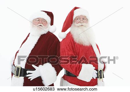 Two men dressed as Santa Claus View Large Photo Image Stock Image - Two men dressed as Santa Claus. Fotosearch