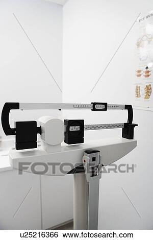 Stock Photograph - Weight Scale, high section, close-up view. Fotosearch