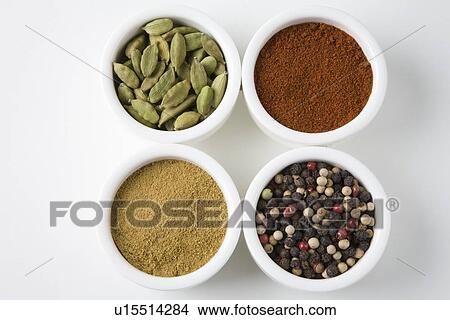 Picture - Whole cardamoms, chilli, peppercorns and cumin. Fotosearch