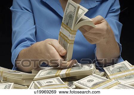 Stock Photo - Woman Counting Money. Fotosearch