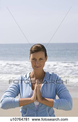Woman exercising at beach View Large Photo Image Stock Image - Woman exercising at beach. Fotosearch