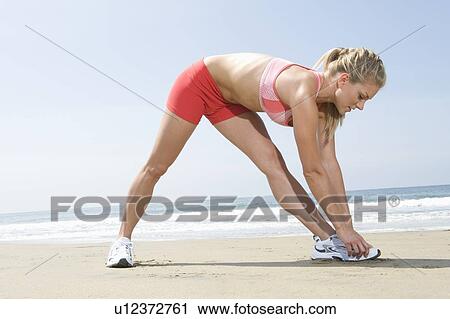 Woman exercising at beach View Large Photo Image Stock Image - Woman exercising at beach. Fotosearch