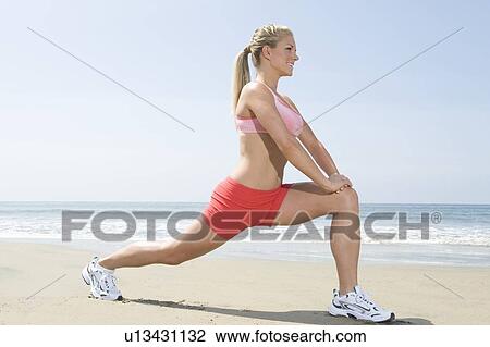 Woman exercising at beach View Large Photo Image Stock Image - Woman exercising at beach. Fotosearch