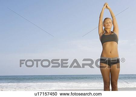 Woman exercising at beach View Large Photo Image Stock Image - Woman exercising at beach. Fotosearch