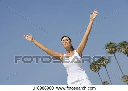 Woman exercising at beach View Large Photo Image Stock Image - Woman exercising at beach. Fotosearch