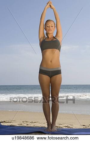 Woman exercising at beach View Large Photo Image Stock Photograph - Woman exercising at beach. Fotosearch
