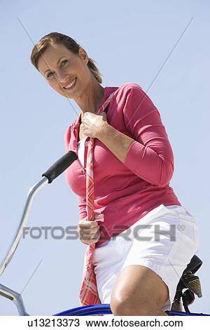 Stock Image - Woman exercising on beach. Fotosearch
