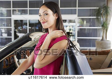 Woman Holding Shopping Bags View Large Photo Image Picture - Woman Holding Shopping Bags. Fotosearch