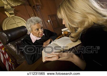 Stock Photography - Woman pleading with judge in court room. Fotosearch
