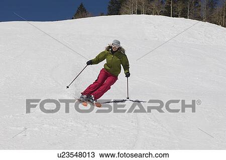 Woman Skiing Down Ski Slope View Large Photo Image Stock Image - Woman Skiing Down Ski Slope. Fotosearch