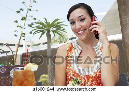 Picture - Woman Talking on a Cell Phone. Fotosearch