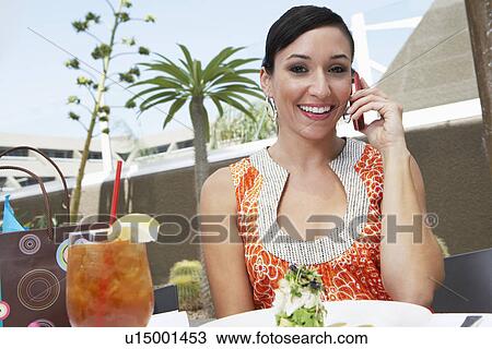 Stock Image - Woman Talking on a Cell Phone. Fotosearch