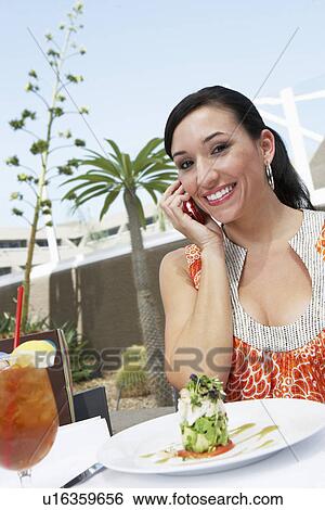 Woman Talking on a Cell Phone View Large Photo Image Stock Photograph - Woman Talking on a Cell Phone. Fotosearch