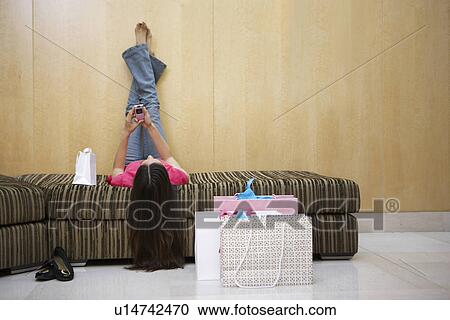 Stock Image - Woman Text Messaging. Fotosearch